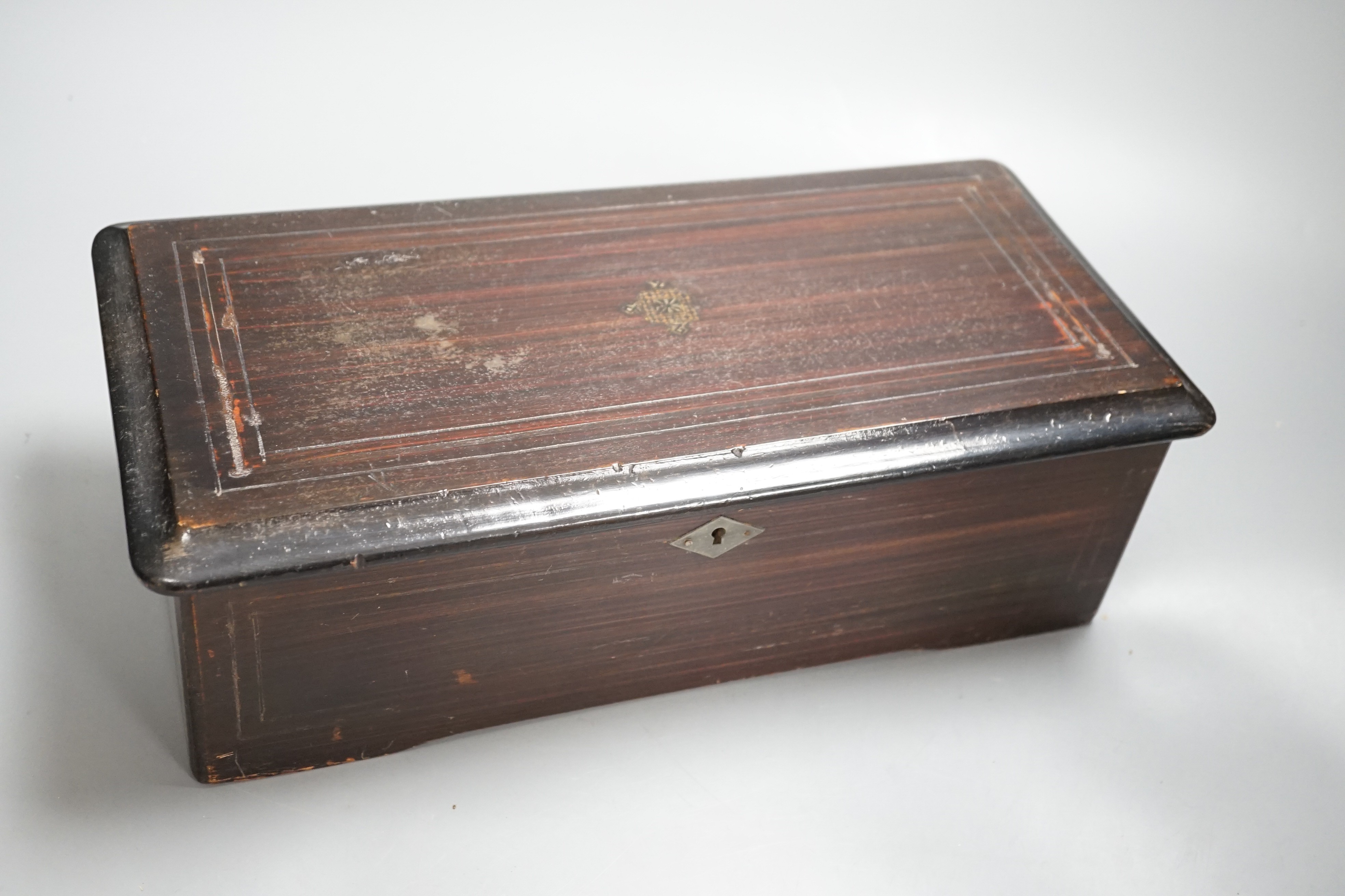 A late 19th century Swiss musical box. Case 37cm long, cylinder 15.5cm long